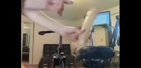  Cam girl rides big dildo while riding on a bicycle